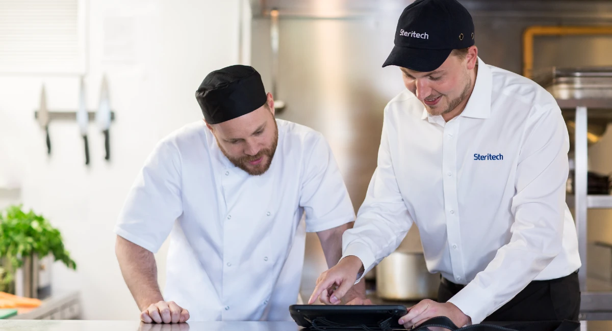 Steritech colleague talking to food service worker
